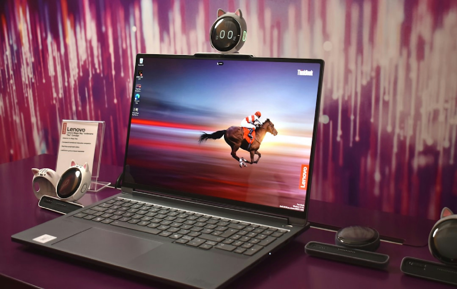 Laptop displaying a horse racing on its screen