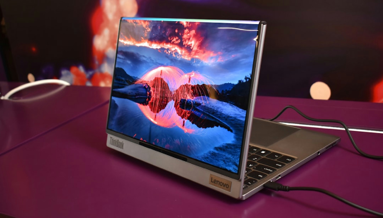 Modern laptop displaying a vibrant landscape on screen
