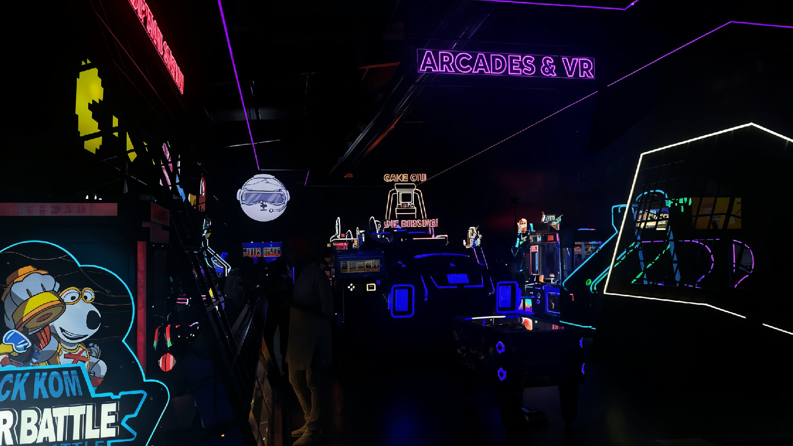 a dark room with neon signs and neon lights