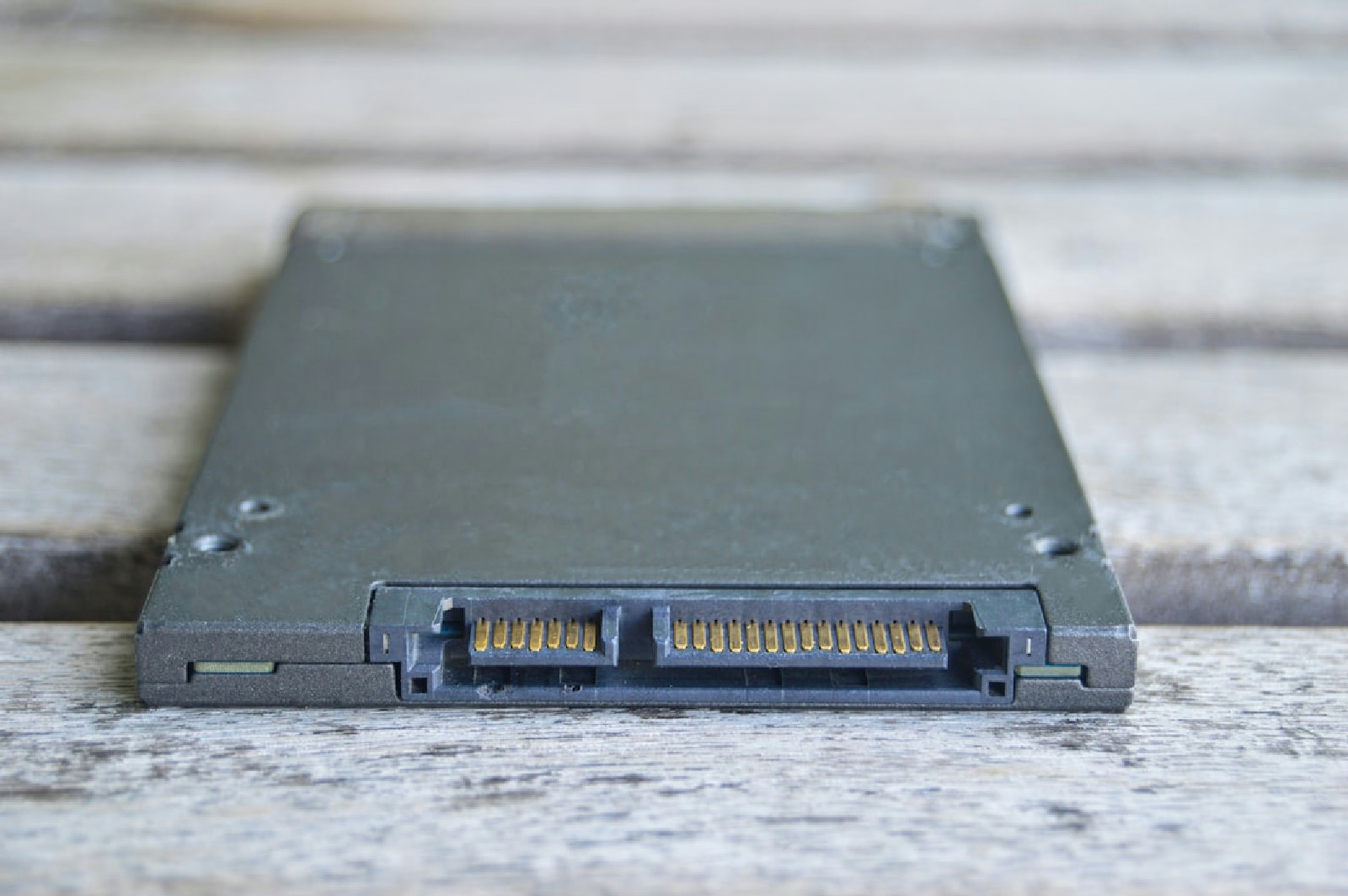 A close up of a device on a wooden surface