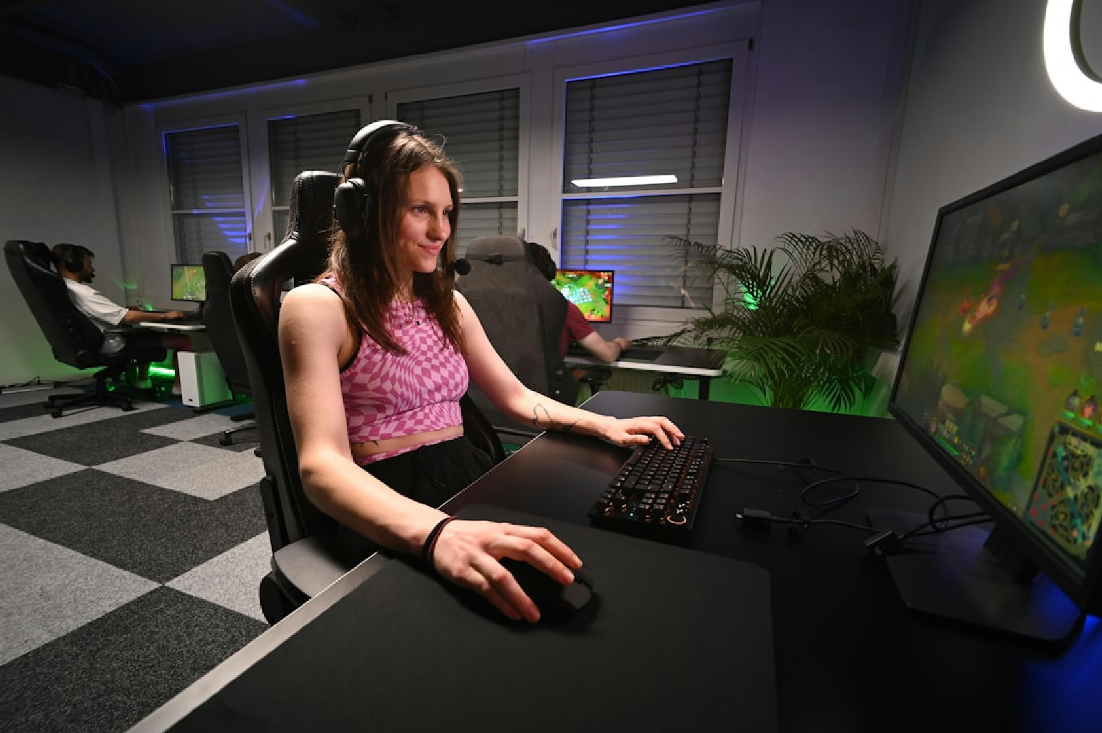 A woman sitting at a desk using a computer
